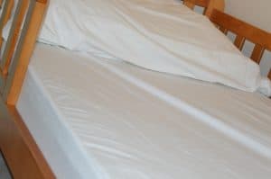 B-Sensible sheets on a cot bed 