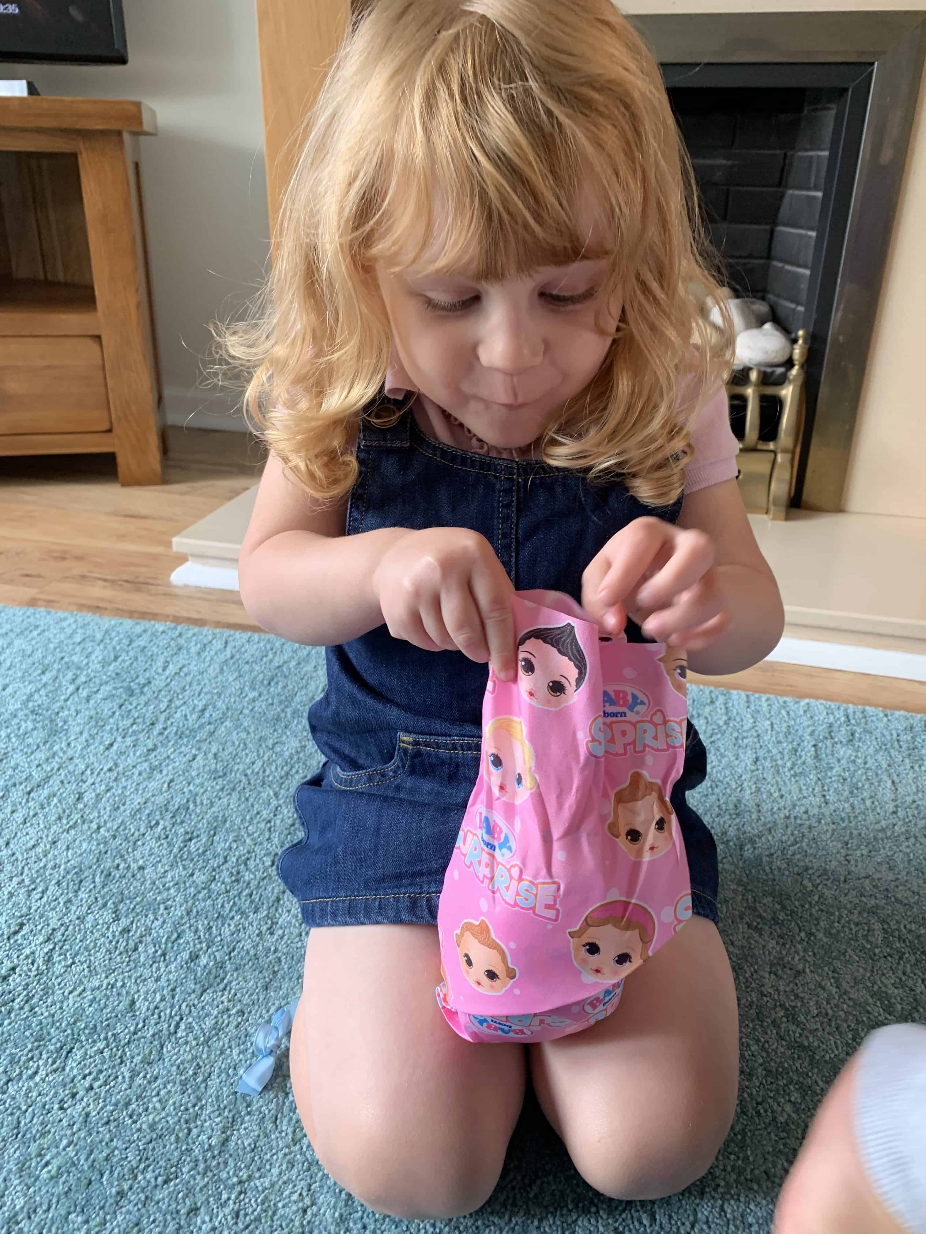 Opening her BABY Born surprise doll 